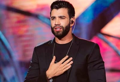 Gusttavo Lima canta para acordar convidada em casamento de Éder Militão e Tainá