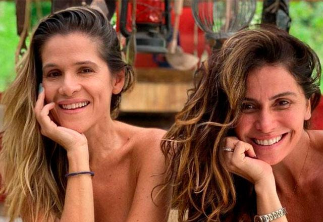 ingrid e giovana deitadas uma do lado da outra