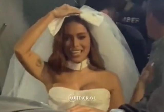 Anitta vestida de noiva durante gravação de clipe