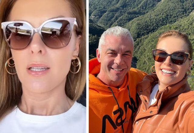 Ana Hickmann e Alexandre Correa posam abraçados sorrindo em cima de uma montanha