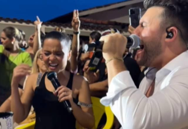 Maiara e Murilo Huff cantando em um bar
