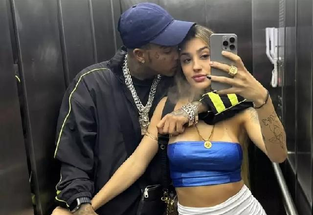 Bia miranda e gato preto