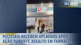 Policiais recebem aplausos após ação durante assalto em farmácia Policiais recebem aplausos após ação durante assalto em farmácia