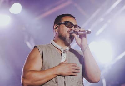 Belo se pronuncia após fãs gritarem nome de Viviane Araújo em show